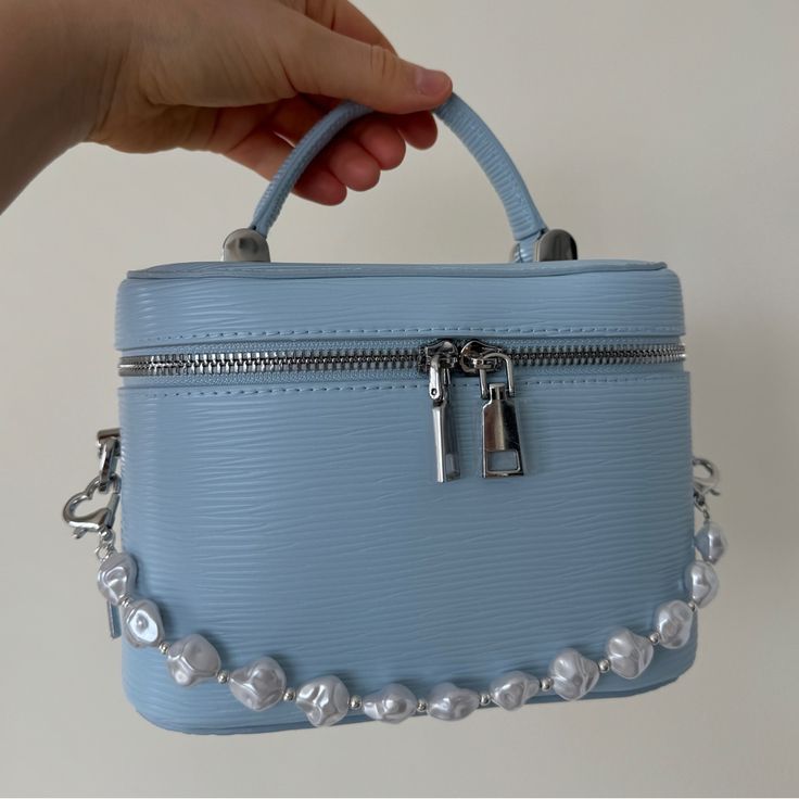 Bloomingdale’s Blue Faux Saafiano leather crossbody vanity bag